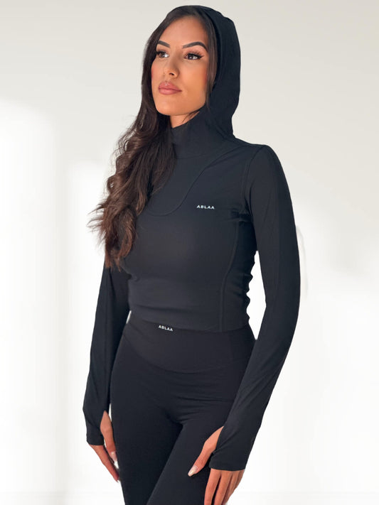Haut de sport femme capuche intégrée – Confort gainant & style épuré